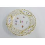 Meissen cabinet plate with gilt edge and reticulated rim with hand painted floral sprays and blue