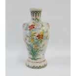 Japanese earthenware vase, the shoulders with mask heads and painted with flowers and foliage,
