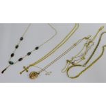 A mixed lot to include yellow metal chain necklaces to include a locket and crucifix, etc (6)