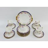 Adderleys porcelain teaset with rose pattern and gilt edge rims, comprising eight cups, eleven