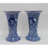 Pair of Royal Bonn, Franz Anton Mehlem blue and white vases with figural panels against a foliate