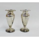 A pair of Edwardian silver vases of tapering fluted form, Chester 1906, 14cm high (2)