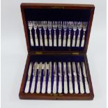 Twelve mother of pearl and Epns handled fruit knives and forks, in a mahogany canteen case