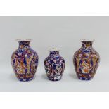 Garniture of Chinese Imari high shouldered baluster vases, typically painted with flowers, foliage