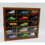 Showcase containing fifteen modern die cast Corgi trucks