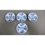 Group of four late 18th / early 19th century saucers, finely moulded and decorated in blue