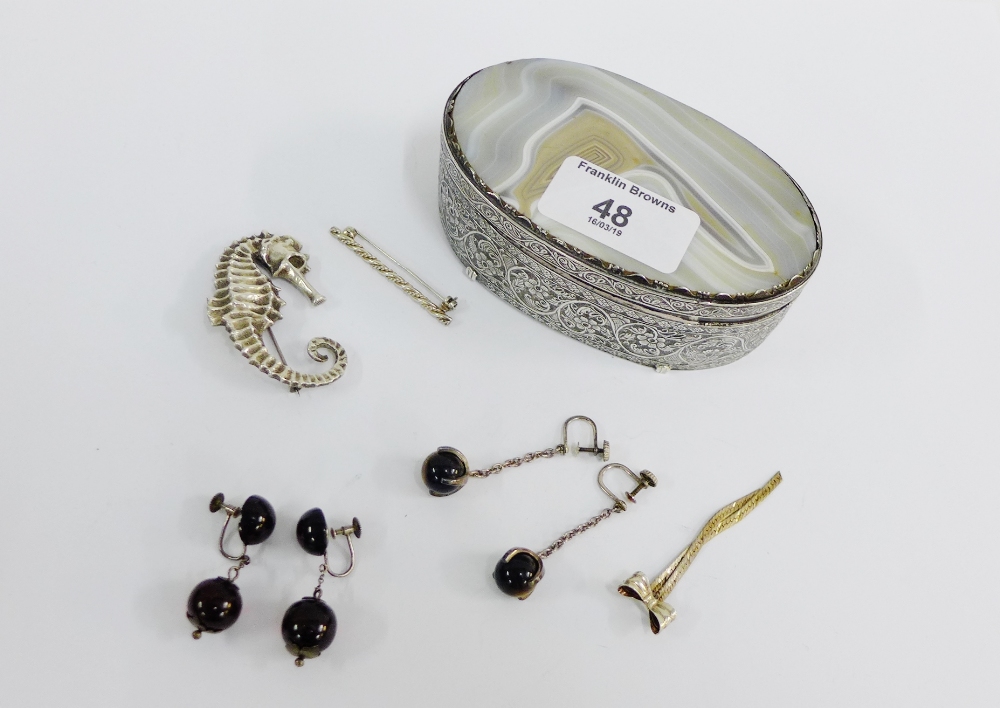 A collection of silver brooches to include a seahorse together with hardstone and tigers eye