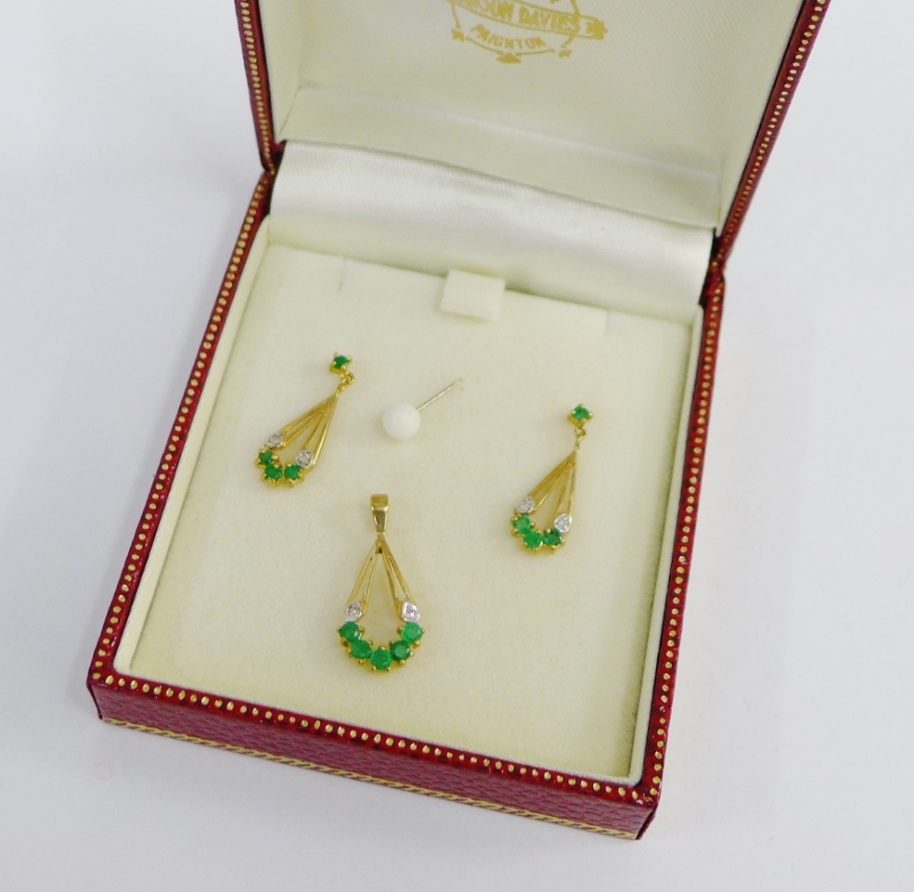 A pair of 9 carat gold emerald and diamond set earrings together with a matching pendant (3), boxed