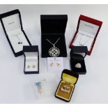 A collection of silver brooches and pendants to include Ortak and Hot Diamonds, etc together with