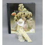 NAO porcelain figure of a Clown, together with the Lladro Art of Porcelain Hardback Collectors Book,