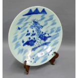 Chinese blue and white plate with a Village by a River pattern, four character marks verso, diameter