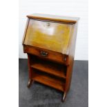 Early 20th century Arts & Crafts style oak bureau with a fall front above a single frieze drawer and