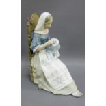 Lladro figure of a 'Girl doing Embroidery', modelled seated, with printed backstamps and dated 1977,