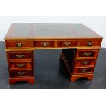 Yewwood pedestal desk, the rectangular top with three leather skivvers, 79 x 137cm