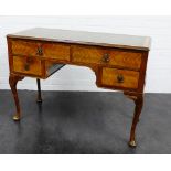Mahogany desk, the rectangular top with green leather skivver, above four short drawers raised on