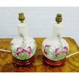 Pair of pottery table lamp bases, with fruit and foliage pattern, 30cm, (2)