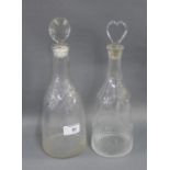 Two late 18th / early 19th century decanters and stoppers, both with fluted and cut bases and