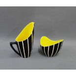 Hornsea black and white glazed sugar bowl and cream jug with yellow interior, (2)