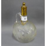 Victorian globular decanter, engraved with fruiting vines with a gilt metal collar and cover and
