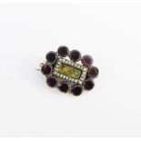 19th century garnet and seed pearl mourning brooch, with glazed hair panel to centre 2.5cm wide