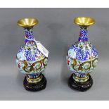 Pair of Cloisonne bottle neck vases with 'Dragon and Flaming Pearl' pattern, on hardwood bases,