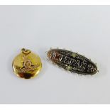 Silver Mizpah brooch and a Royal Artillery yellow metal locket (2)