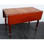 Mahogany Pembroke table with a drawer to side, on turned tapering supports 72 x 106cm