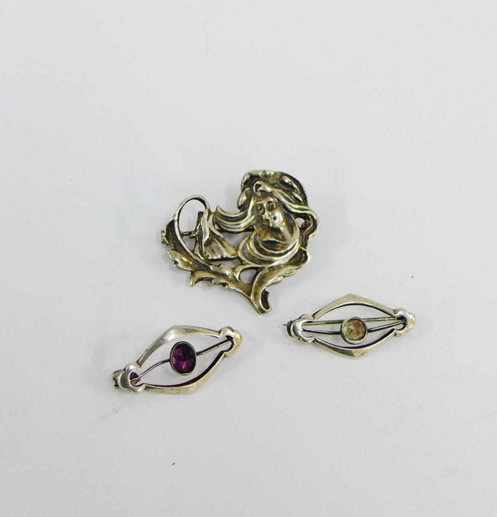 Two Sterling silver brooches, each with CH makers mark together with a white metal Art Nouveau style