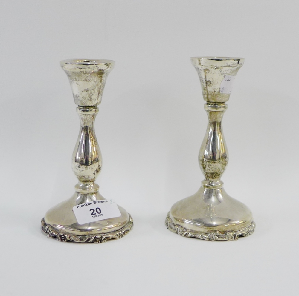 Pair of Mexican silver candlesticks, with knop stems and circular footrims, stamped 925, (2) 15cm