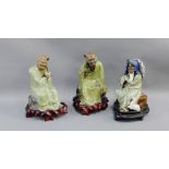 Group of three Chinese green glazed figures on shaped hardwood bases, tallest 22cm, (3)