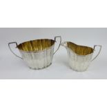Victorian silver fluted cream jug and sugar bowl, each with bright cut foliate borders, by Aird &