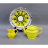 Canary yellow glazed teapot and ribbed jug, together with a yellow and silver lustre plate, (3)
