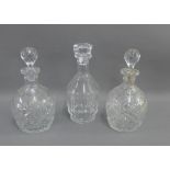 Pair of cut glass decanter and stoppers, together with a Baccarat decanter with faceted base and