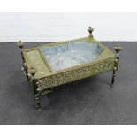 An unusual brass low table, with a recess planter to top, with Arabic style calligraphy to the