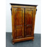 Mahogany two door cupboard, the panelled doors with ebonised trims, 160 x 106cm