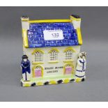 Sarah Moore Whitby pottery money bank house, 13cm high