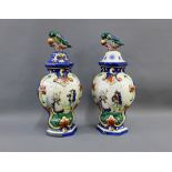 Pair of Quimper pottery hexagonal vase and covers, the lids with bird finials, 38cm, (a/f) (2)