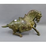 Bronze patinated metal Tang style horse, 28 x 44cm