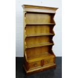 Oak waterfall bookcase with two short drawers to the base, 204 x 130cm