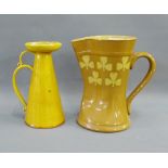 Royal Doulton 'Clover' patterned jug, together with a CH Brannam Barum yellow glazed jug, tallest