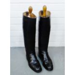 Pair of gents vintage black leather boots, size 9, together with wooden stretchers, (a lot)