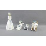 Collection of two Lladro figures to include a 'Girl in Rocking Chair' and a 'Cat with a Mouse',