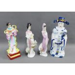 Blue and white Japanese style figure together with three others, (4)