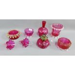 Collection of Cranberry glass to include a small oil lamp, vases, bowls, baskets etc., (8)