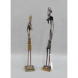 Two bronze African style elongated figures on square plinth bases, tallest 40cm, (2)