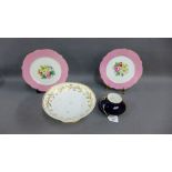 Pair of late 19th / early 20th century porcelain plates with pink rims and hand painted floral