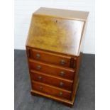 Mahogany and burrwood veneered bureau, the fall front with a fitted interior, over pull out slides