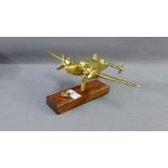 Brass Spitfire style aeroplane on a rectangular wooden plinth base, wingspan 27cm