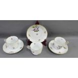 Herend porcelain set of three tea cups and four saucers, 20th century, hand painted with birds and