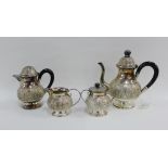 An Eastern white metal teaset comprising teapot, hot water pot, cream jug and sugar bowl (4)